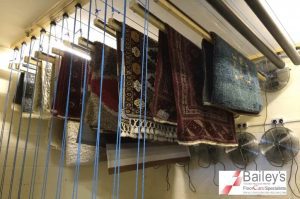 Professional Rug Cleaning in Leicester - www.FloorCareSpecialists.co.uk Clean rugs hanging in Bailey’s specialist rug drying room